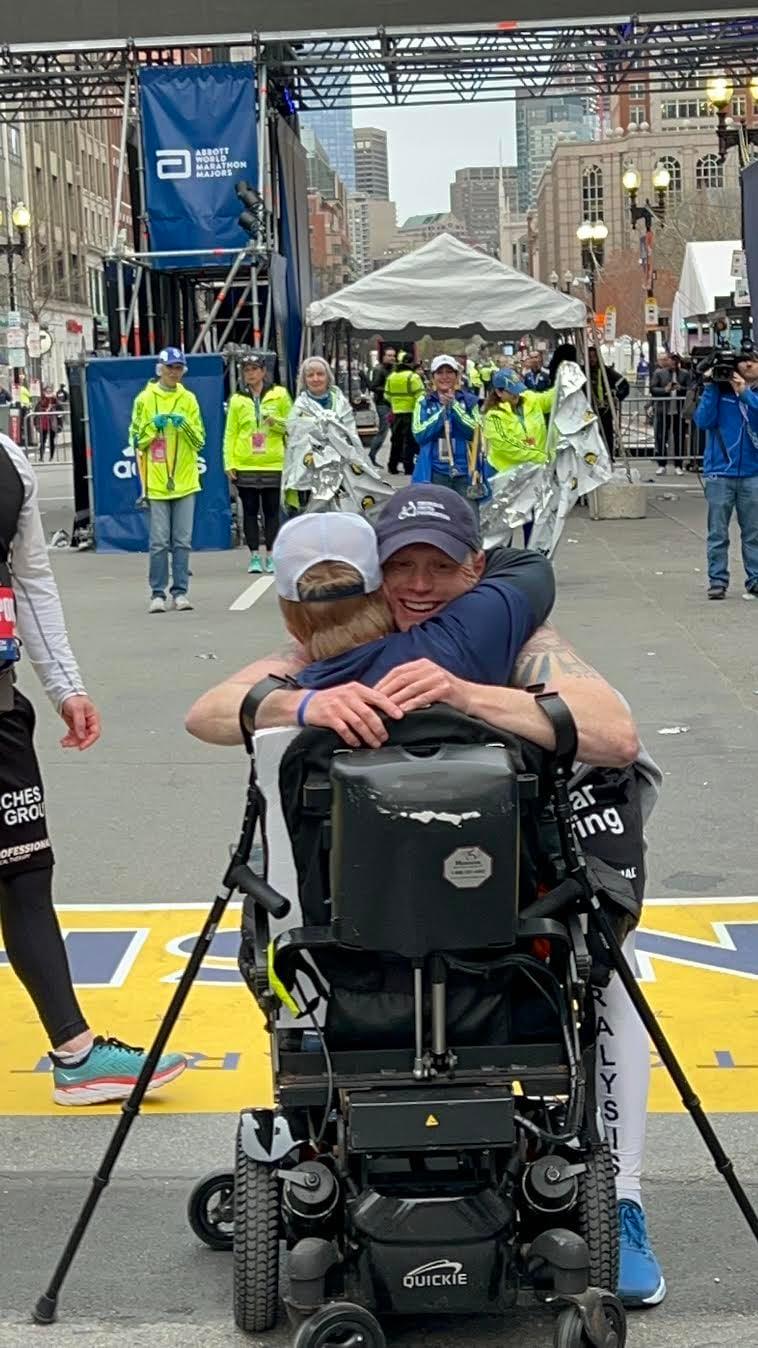 tom-smith-hugging-someone-at-boston-marathon